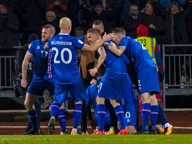 Iceland players celebrate after beating Kosovo to book their place at the 2018 World Cup