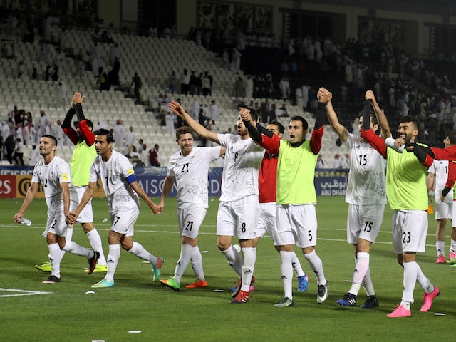 The Iran team celebrates after their World Cup qualifier with Qatar in June 2017
