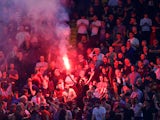 Liverpool fans light a flare inside the stadium before the Champions League semi-final second leg against Roma on May 2, 2018
