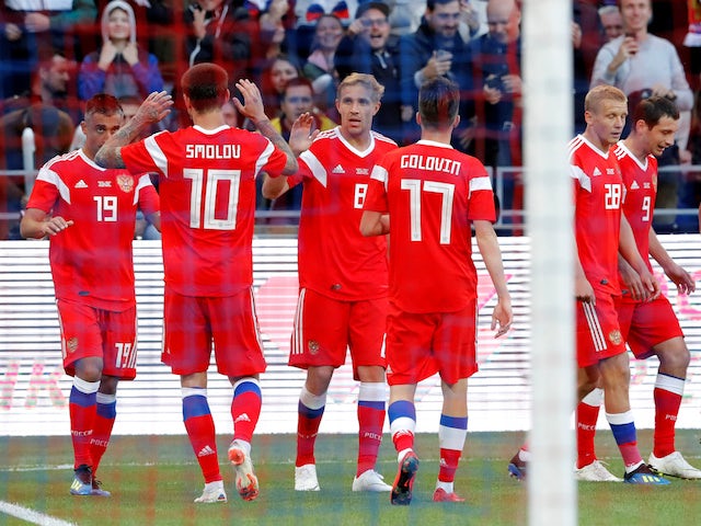 Russia's Aleksandr Samedov celebrates scoring their first goal with teammates during the World Cup warm-up friendly with Turkey on June 5, 2018