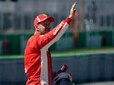Ferrari's Sebastian Vettel celebrates qualifying in pole position for the Canadian Grand Prix on June 9, 2018