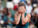 Simona Halep celebrates winning the French Open by hiding her face on June 9, 2018