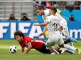 Amr Warda, Martin Caceres and Giorgian De Arrascaeta during the World Cup game between Egypt and Uruguay on June 15, 2018