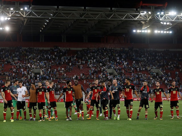 Belgium's players celebrate qualifying for the 2018 World Cup following a win over Greece