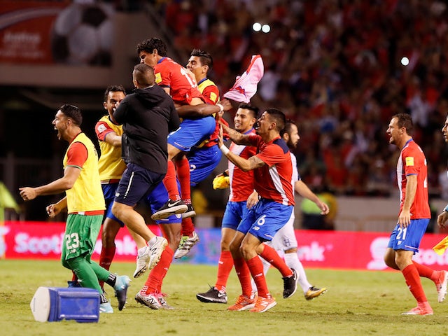 Costa Rica's players celebrate qualifying for the 2018 World Cup