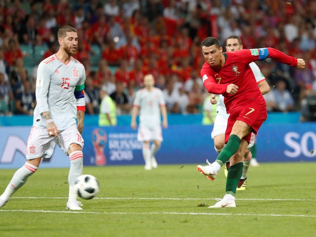 Cristiano Ronaldo scores his side's second during the World Cup group game between Portugal and Spain on June 15, 2018