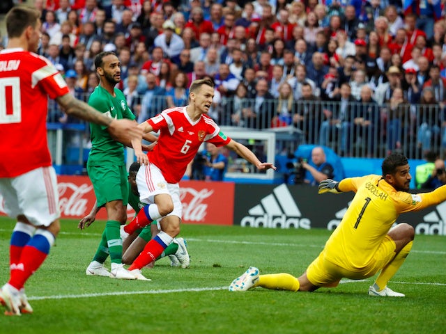 Denis Cheryshev scores the second during the World Cup opener between Russia and Saudi Arabia on June 14, 2018