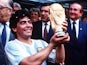 Argentina's Diego Maradona lifts the World Cup trophy after helping his team to the 1986 title