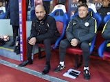 Manchester City assistant Domenec Torrent watches on with manager Pep Guardiola during a Premier League match in March 2018
