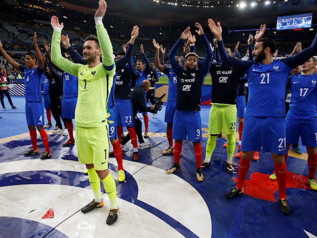 France's players celebrate qualifying for the 2018 World Cup in Russia