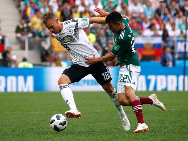 Germany's Joshua Kimmich in action with Mexico's Hirving Lozano on June 17, 2018