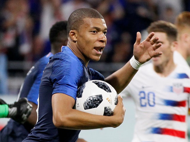 France's Kylian Mbappe celebrates scoring their first goal against USA on June 9, 2018