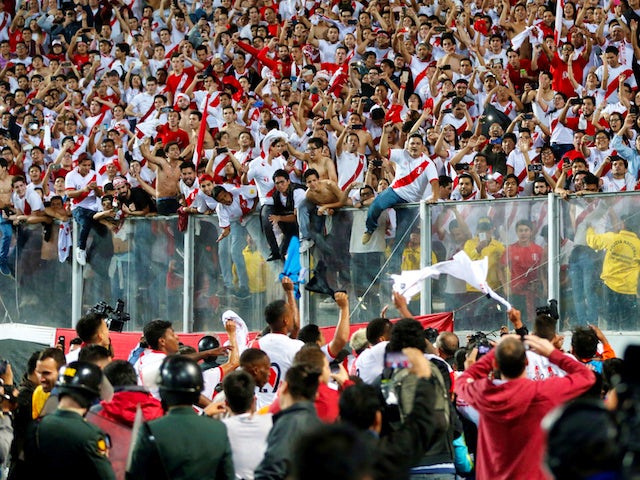 Peru players celebrate with fans after securing their place at the 2018 World Cup