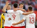Robert Lewandowski celebrates scoring during Poland's international friendly with Lithuania on June 12, 2018