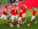 Russia's players celebrate going 2-0 up against Saudi Arabia in their Group A clash with Saudi Arabia in Moscow at the 2018 World Cup on June 14, 2018