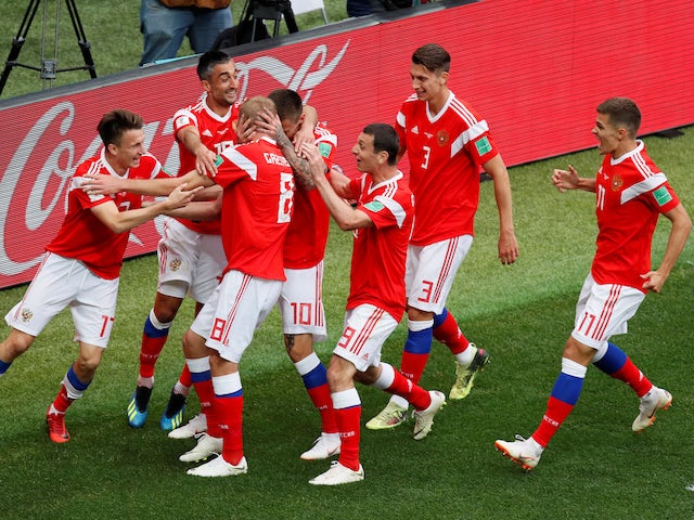 Russia's players celebrate going 2-0 up against Saudi Arabia in their Group A clash with Saudi Arabia in Moscow at the 2018 World Cup on June 14, 2018