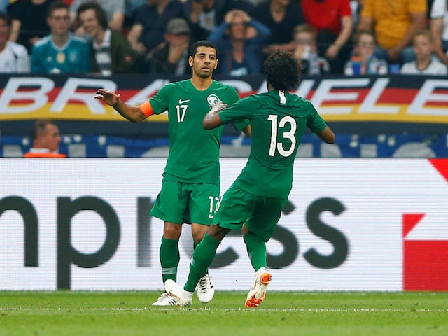 Saudi Arabia's Taiseer Al Jassam celebrates scoring their first goal with Yasser Al-Shahrani during the international friendly with Germany on June 8, 2018