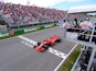 Ferrari's Sebastian Vettel passes the chequered flag to win the Canadian Grand Prix on June 10, 2018