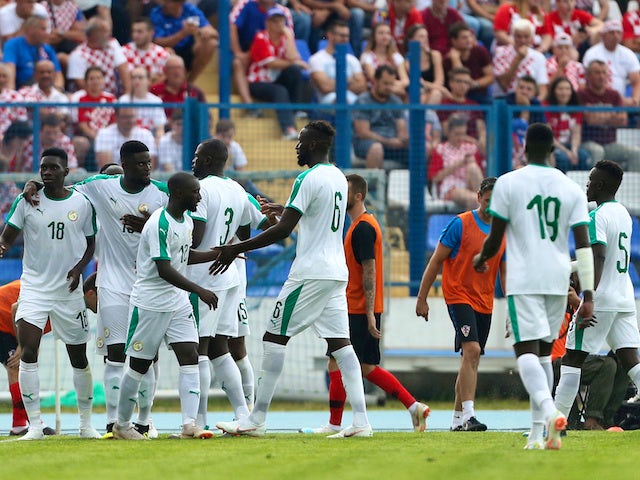 Senegal's players celebrate during their international friendly with Croatia in June 2018