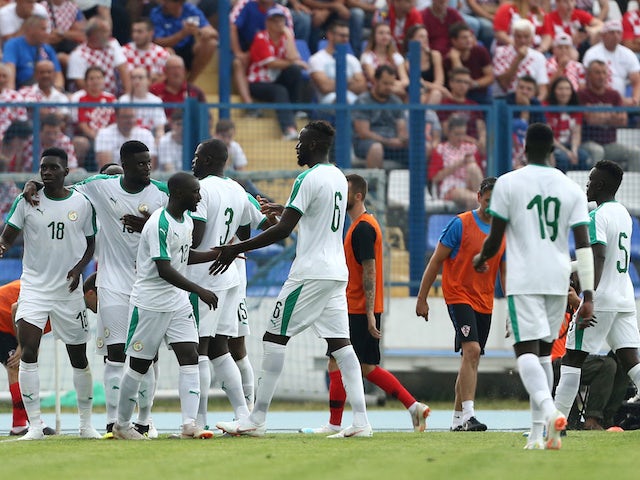 Senegal's players celebrate during their international friendly with Croatia in June 2018