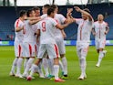 Serbia's players celebrate scoring in the international friendly against Bolivia on June 9, 2018