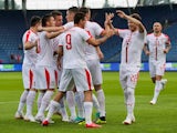 Serbia's players celebrate scoring in the international friendly against Bolivia on June 9, 2018