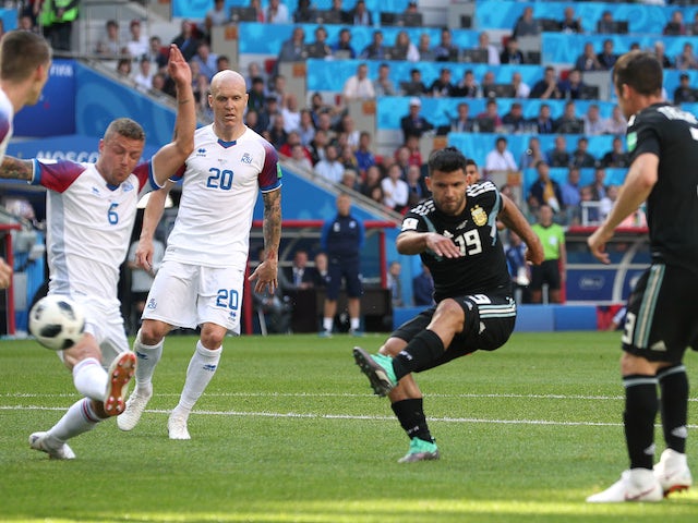 Sergio Aguero scores the opener during the World Cup group game between Argentina and Iceland on June 16, 2018