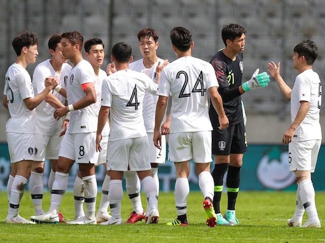 South Korea's players celebrate following their international friendly with Bolivia in June 2018