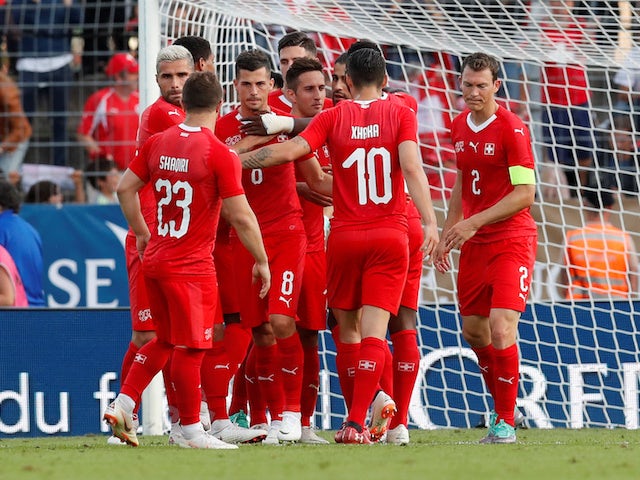 Switzerland's players celebrate a goal during their World Cup warm-up match against Japan on June 8, 2018