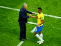 Brazil coach Tite shakes hands with Casemiro during the match against Switzerland on June 17, 2018