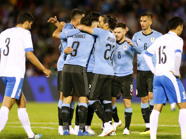 Uruguay's players celebrate scoring during an international friendly with Uzbekistan in June 2018