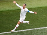 Portugal forward Cristiano Ronaldo celebrates scoring the opening goal during his side's World Cup Group B clash against Morocco on June 20, 2018