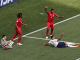 England's Jesse Lingard is fouled for a penalty as Panama's Roman Torres and Fidel Escobar react on June 24, 2018