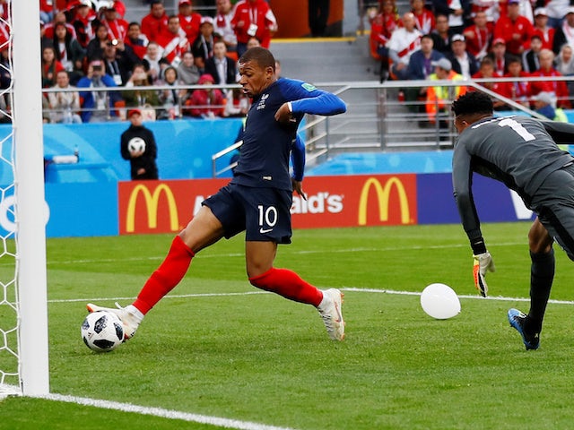 Kylian Mbappe scores the opener during the World Cup group game between France and Peru on June 21, 2018