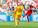 Peru's Andre Carrillo scores their first goal against Australia on June 26, 2018