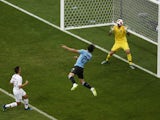 Uruguay's Edinson Cavani scores their first goal past Portugal's Rui Patricio on June 30, 2018