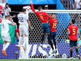 Spain's Gerard Pique handles the ball in the area resulting in a penalty being awarded to Russia on July 1, 2018