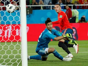 VAR helps Spain confirm top spot