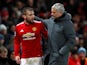 Manchester United manager Jose Mourinho speaks with Luke Shaw as he is substituted off against Bournemouth on December 13, 2017