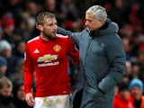 Manchester United manager Jose Mourinho speaks with Luke Shaw as he is substituted off against Bournemouth on December 13, 2017