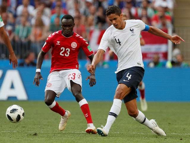 France's Raphael Varane in action with Denmark's Pione Sisto on June 26, 2018