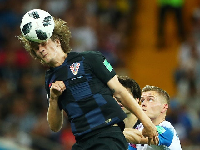 Croatia's Tin Jedvaj in action with Iceland's Alfred Finnbogason on June 26, 2018