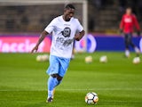 Lazio's Bastos warms up with a picture of Anne Frank on his shirt ahead of the match against Bologna on October 25, 2017 