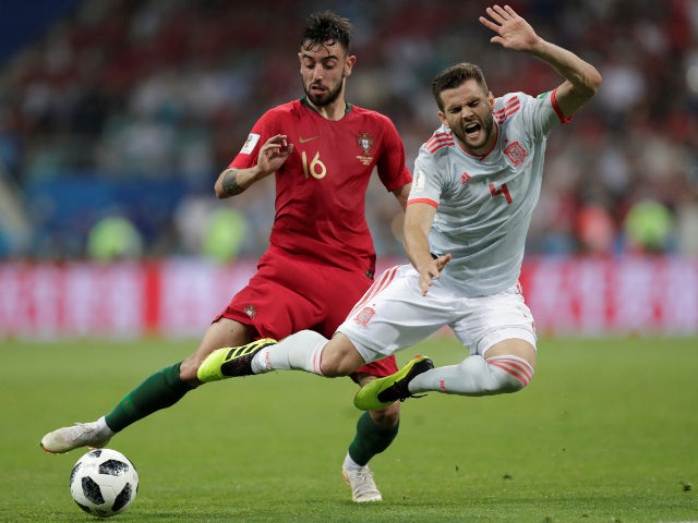 Spain's Nacho in action with Portugal's Bruno Fernandes on June 15, 2018