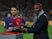 Barcelona's Luis Suarez is presented with the player of the month award for December by Eric Abidal on January 28, 2018 