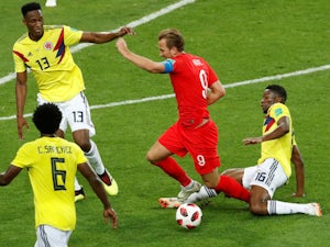 England overcome penalty hoodoo to reach quarters