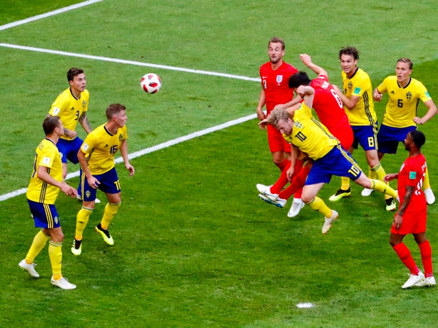 England's Harry Maguire scores their first goal against Sweden on July 7, 2018