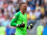 England's Jordan Pickford celebrates after Harry Maguire scored their first goal against Sweden on July 7, 2018