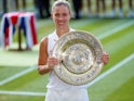 Germany's Angelique Kerber celebrates winning the Wimbledon women's singles final with the trophy on July 14, 2018 