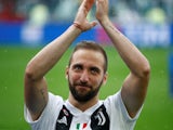 Juventus striker Gonzalo Higuain applauds fans at the end of the 2017-18 Serie A season